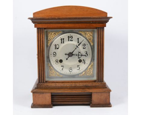 An Edwardian walnut cased mantel clock, architectural casing, movement striking on a gong, 32cm.