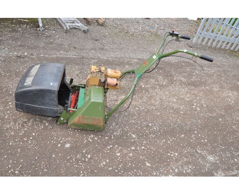 A VINTAGE WEBB AB1474 PETROL CYLINDER MOWER with a Briggs and Stratton 2 hp motor ( engine pulls freely but hasn't been start