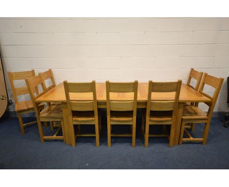 A SOLID OAK EXTENDING DINING TABLE, two additional leaves, on block legs, extended length 250cm x closed length 180cm x depth
