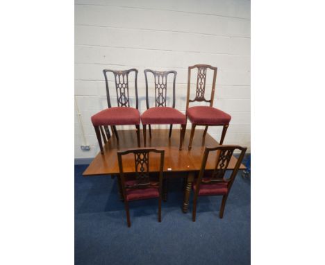 A GEORGIAN WALNUT GATE LEG TABLE, on turned legs, open width 165cm x closed width 60cm x depth 114cm x height 74cm and four E