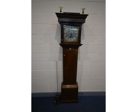 A GEORGE III OAK EIGHT DAY LONGCASE CLOCK, by James Scholfield of Barnsley, Yorkshire, the plain hood with a pair of brass ea