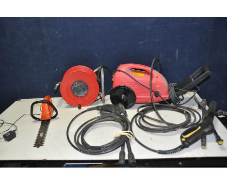 A MOWERLAND JET WASH WITH TWO LANCES ( PAT pass and working), an extension cable and a vintage Sandvik cordless hedge trimmer