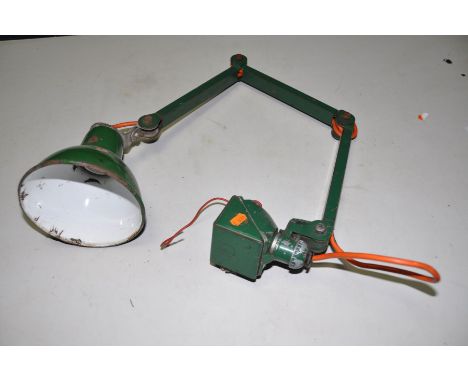 A VINTAGE INDUSTRIAL ARTICULATED WORKSHOP LAMP with a 6 1/2in green and white enamelled shade, a rotating base and four joint