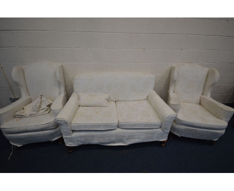 A 19TH CENTURY MAHOGANY SOFA, on cabriole front legs, length 148cm, along with a pair of 20th century wing back armchairs wit