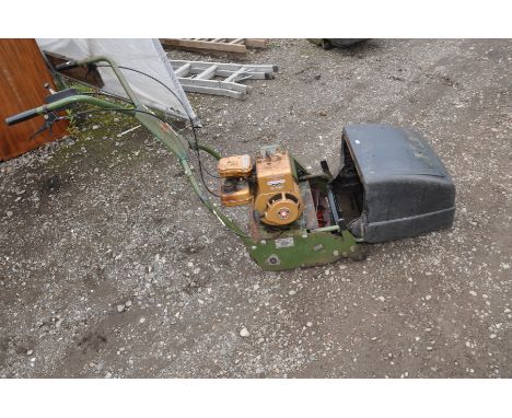 A VINTAGE WEBB AB1474 PETROL CYLINDER MOWER with a Briggs and Stratton 2 hp motor ( engine pulls freely but hasn't been start