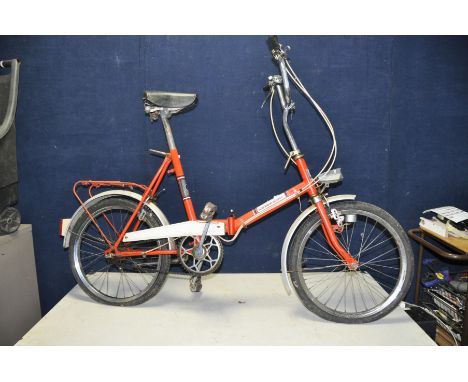 A UNIVERSAL VINTAGE FOLDING BIKE with 3 speed gears, dynamo connected to front and rear lights, 17in frame