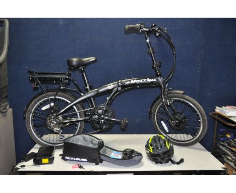 A HARRIER ECO POWER FOLDING ELECTRIC BIKE in Matt Black with one key, charger, two batteries, 6 speed Shimano twist grip gear