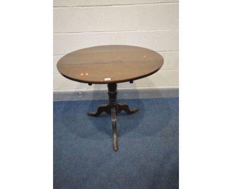 A GEORGIAN OAK CIRCULAR TILT TOP TRIPOD TABLE, on a turned support and splayed legs, diameter 79cm x height 71cm (condition -
