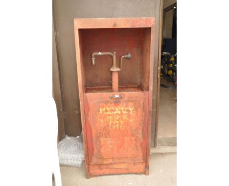 A LARGE VINTAGE METAL FUEL/OIL DISPENSER with sliding drop down door concealing a crank handle pump width 66cm depth 50cm hei