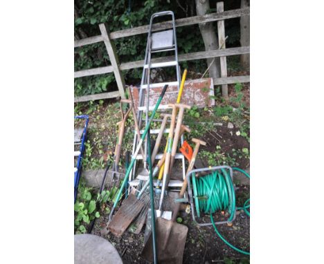 AN ALUMINIUM STEP LADDER, height 202cm and a selection of garden tools including a Stainless Steel spade and fork, a post sho