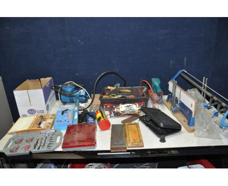 A TRAY CONTAINING HANDTOOLS AND A MINI COMPRESSOR (untested) including a multimeter, screwdrivers, hammers, a mitre saw, rota