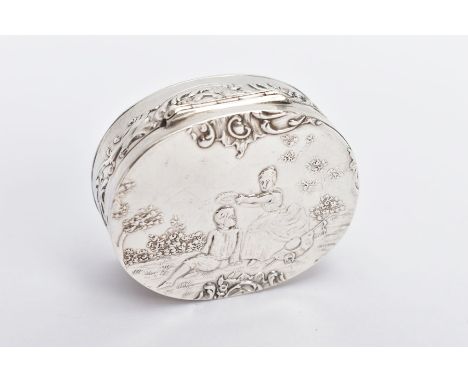 A SILVER OVAL CONTINENTAL SNUFF BOX, repousse figures of a lady placing a laurel leaf on a head, inside shows some sort of ga