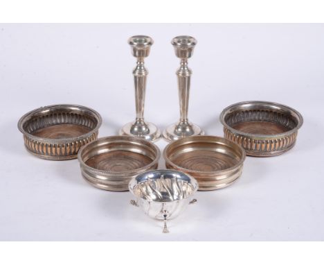 
	
		A pair of silver candlesticks  by A. T. Cannon Ltd., Birmingham 1973, with tapering stems and on circular bases, 18.5cm 