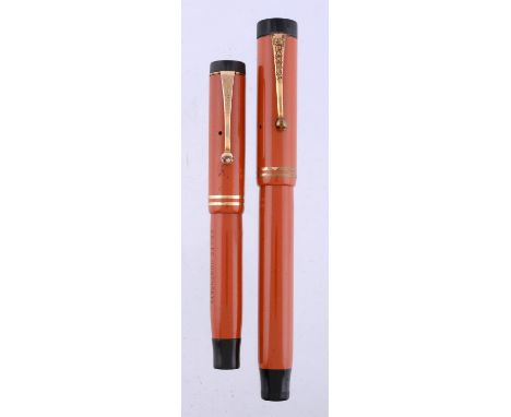 
	
		Parker, Duofold Lucky Curve, an orange fountain pen, the cap with gilt clip and double cap band, button filling system, 