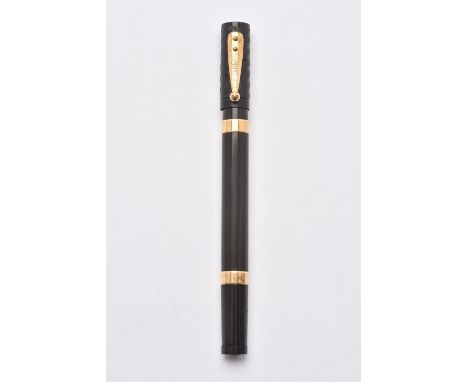 
	
		Waterman's, Ideal, a black fountain pen, the cap with a clip, the barrel with two 18 carat gold bands, hallmarked London