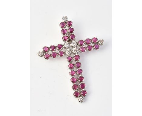 
	
		A ruby and diamond cross, set with brilliant cut diamonds, approximately 0.64 carats total, with circular cut ruby arms,