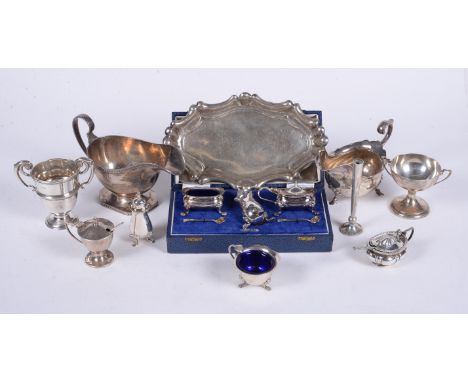 
	
		A collection of silver items, to include: an oval sauce boat by Walker &amp; hall, Sheffield 1926, with a loop handle an