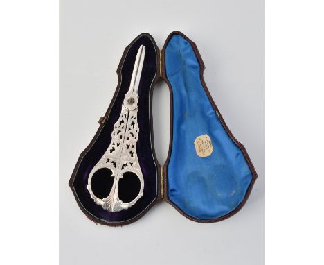 
	
		A cased pair of Victorian silver grape scissors by Josiah Williams &amp; Co., Exeter 1858, pierced and engraved with gra