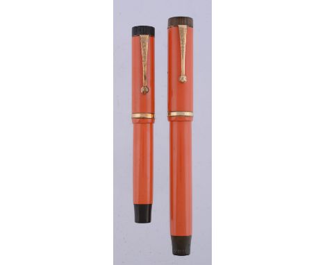 
	
		Parker, Duofold Lucky Curve, an orange fountain pen, the cap with gilt clip and cap band, button filling system, inked; 