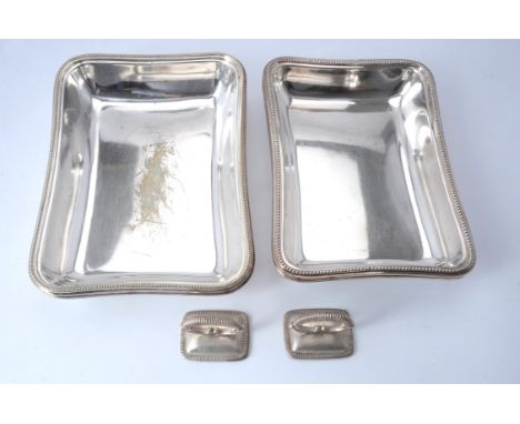 
	
		A pair of electro-plated rectangular entree dishes and covers with matched silver handles, the dishes by William Hutton 