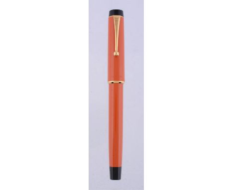 
	
		Parker, Duofold, an orange ball point pen, the cap with a gilt clip and cap band, with a Parker box (1)
		
		Condition R