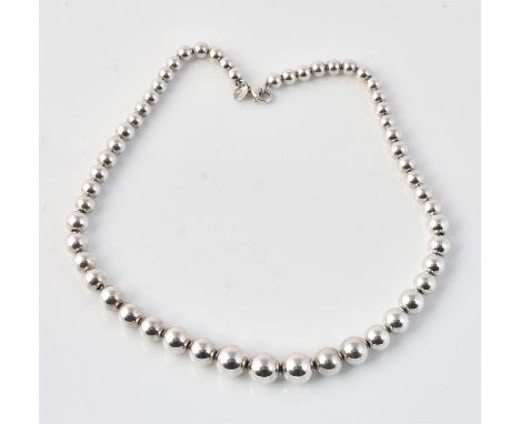 
	
		A silver bead link collar necklace by Tiffany &amp; Co., composed of 6mm to 11mm silver beads to a visor link clasp, sig