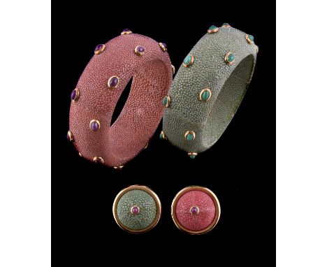 
	
		A shagreen and ruby bangle, the pink shagreen set with oval cabochon rubies in collet settings, stamped 750 with Italian