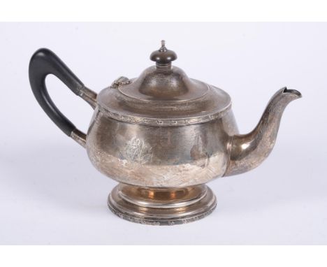 
	
		A silver circular tea pot by Walker &amp; Hall, Sheffield 1922, with a composition finial to the domed cover and loop ha