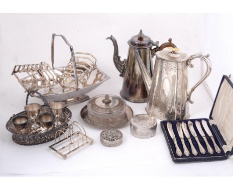 
	
		A pair of silver six division toast racks by Frank Cobb &amp; Co. Ltd., Sheffield 1964, with shaped handles, 13cm (5in) 