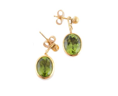 
	
		A pair of peridot earrings by Natalia Josca, the oval cut peridot in collet settings, with post fittings, engraved NJ an
