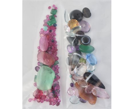 
	
		A group of un-mounted gemstones, to include emeralds, ruby, aquamarine, banded agate and other gemstones

	

