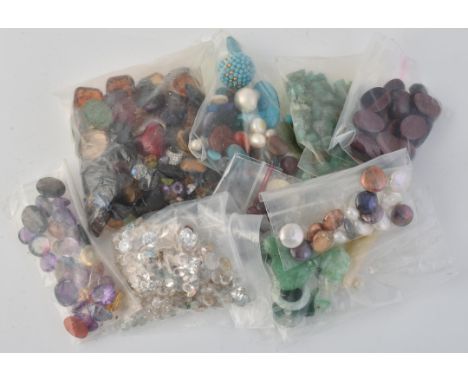 
	
		A group of un-mounted gemstones, to include jadeite, agate, amethyst, ruby, garnet and other gemstones

	

