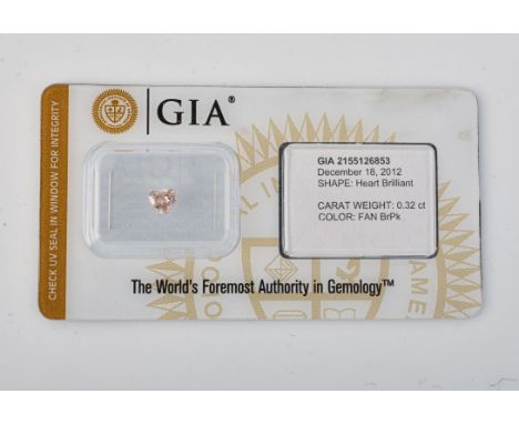 
	
		†&nbsp;An un-mounted brown - pink coloured diamond, heart brilliant cut, stated to weigh 0.32 carats, in a GIA blister p