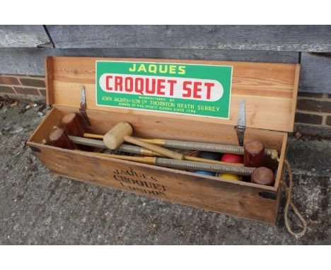 A Jacques croquet set, in caseItems included: There's four large mallets.One small mallet.Four coloured balls, 1 red, 1 yello