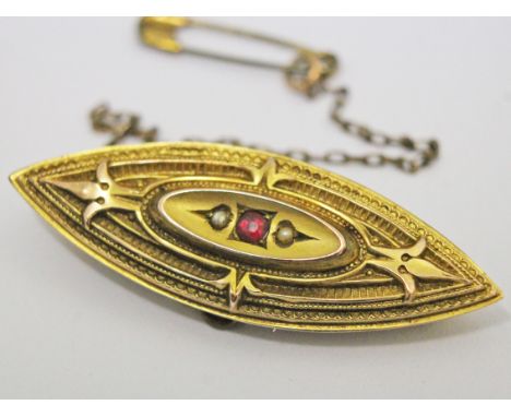 A Victorian 9ct gold ruby and half cut pearl brooch, length 4.8cm, gross wt. 4.3g.