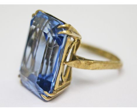 A 9ct gold ring set with a large blue stone, gross wt. 6.5g, size I/J.