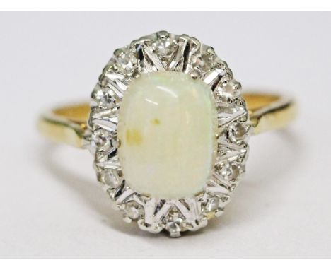 An 18ct gold diamond opal ring, gross wt. 4.1g, size N.