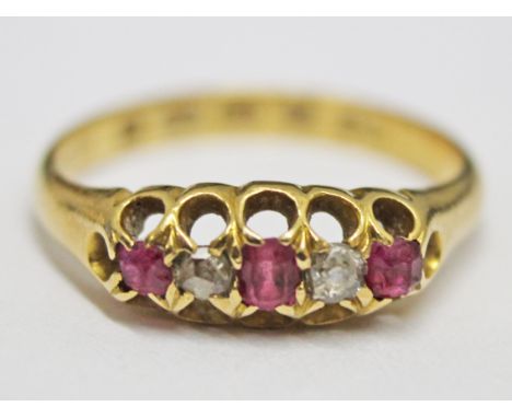 An 18ct gold diamond and ruby ring, gross wt. 2.3g, size I/J