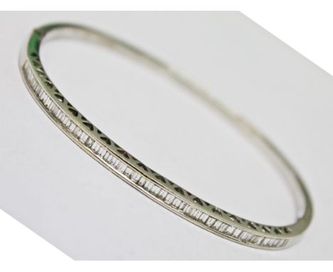 An 18ct white gold diamond bangle, diam. approx. 5.5cm, gross wt. 15.5g.
