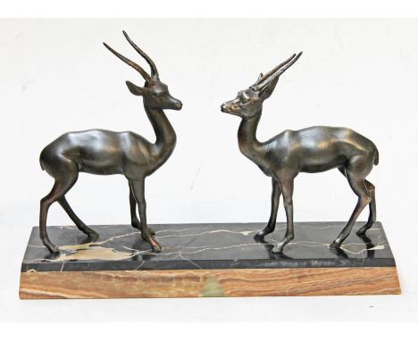 A French Art Deco spelter figure on marble base, length 39cm.