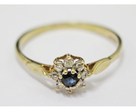 A 9ct gold diamond sapphire ring, gross wt. 1.3g.