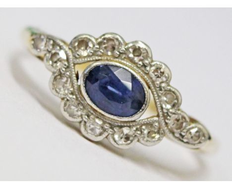 An Art Deco 18ct gold and platinum diamond and sapphire ring, gross wt. 2.4g, size L.