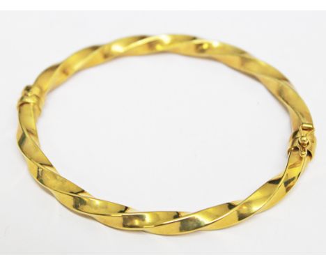 A 9ct gold bangle, wt. 5.4g.