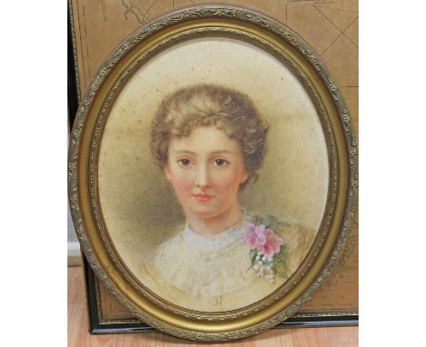 Early 20th Century School, oval portrait of a girl, 39cm x 49cm, monogrammed 'E.L.M.C.', framed.