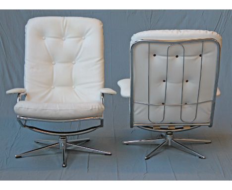 A pair of 1970s tubular chrome and button leatherette swivel lounge chairs. W76cm D90cm H93cm.