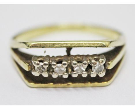 A 14ct gold ring set with four diamonds, gross wt. 4.4g, size O.