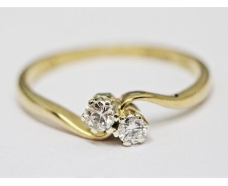 A 9ct gold two stone diamond ring, gross wt. 1.5g, size N.