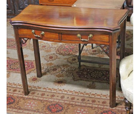 A Georgian mahogany serpentine card table. W91cm D44cm H74cm.