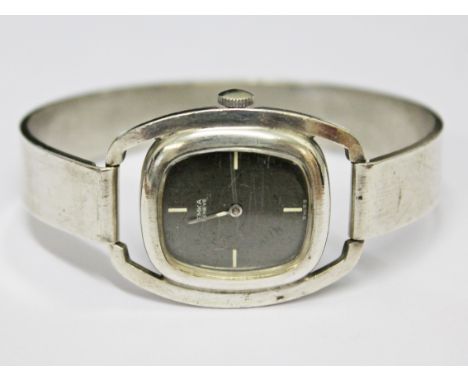 A modern sterling silver bangle wristwatch by Emka, diam. approx. 5.5cm.