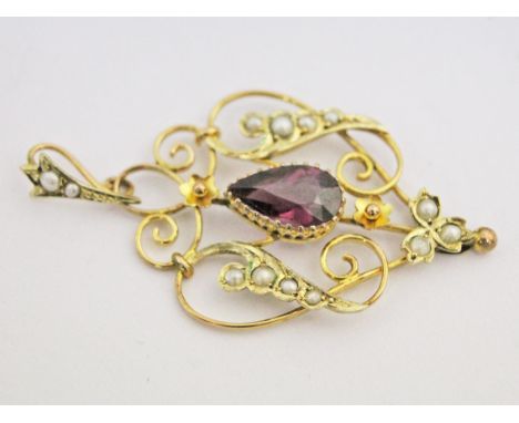 A Victorian/Edwardian 9ct gold seed pearl and amethyst pendant, length 4cm, gross wt. 2.1g.